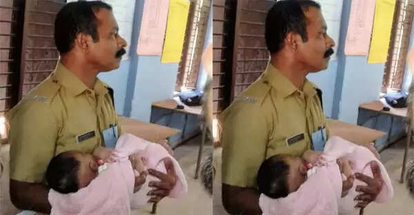 അമ്മ വോട്ടുചെയ്യാന് പോയി; പോലീസുകാരന്റെ കൈയ്യില് ചാഞ്ഞുറങ്ങി കുഞ്ഞുവാവ; ഫോട്ടോ വൈറലാകുന്നു