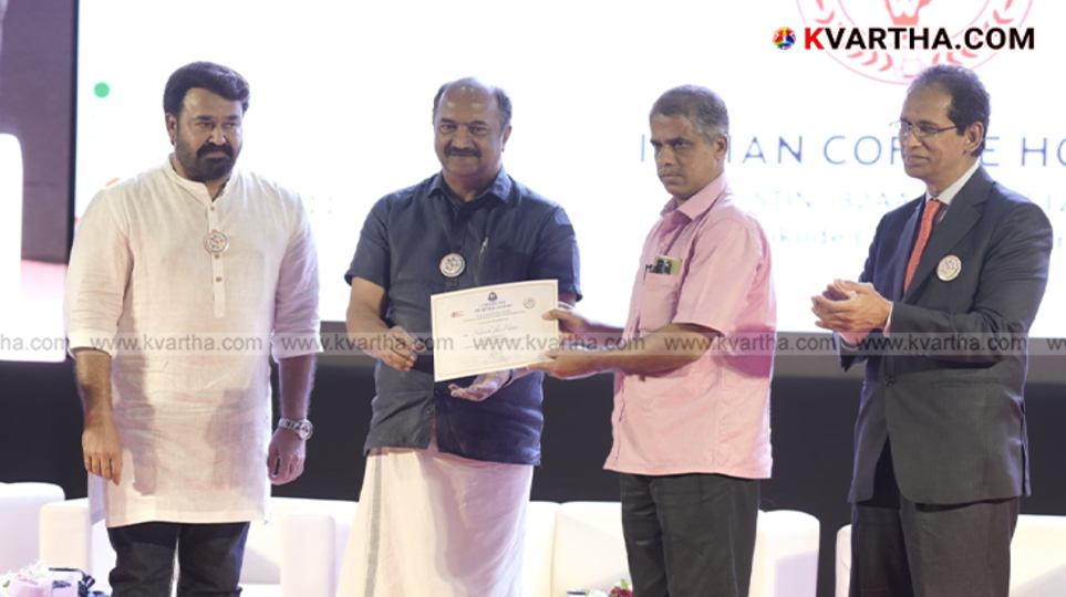 Indian Coffee House representatives receiving award with Minister KN Balagopal, Mohanlal present