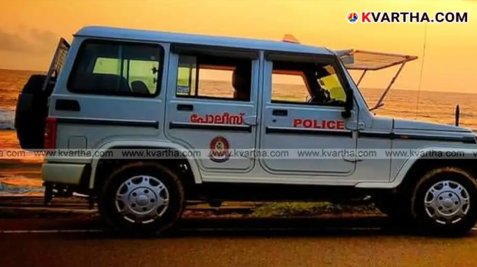 Kerala police officials investigating a crime scene.