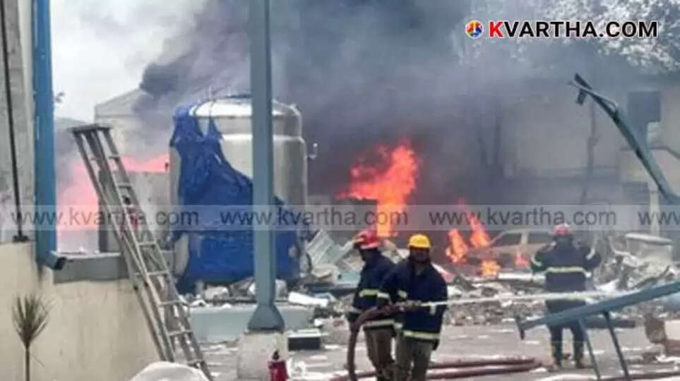 Smoke rising from a burnt pharmaceutical factory building in Telangana after an explosion.