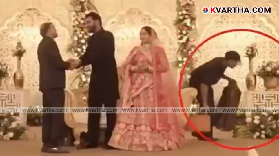 CCTV frame showing a suspect in a suit stealing a bag from a wedding stage in Jaipur.