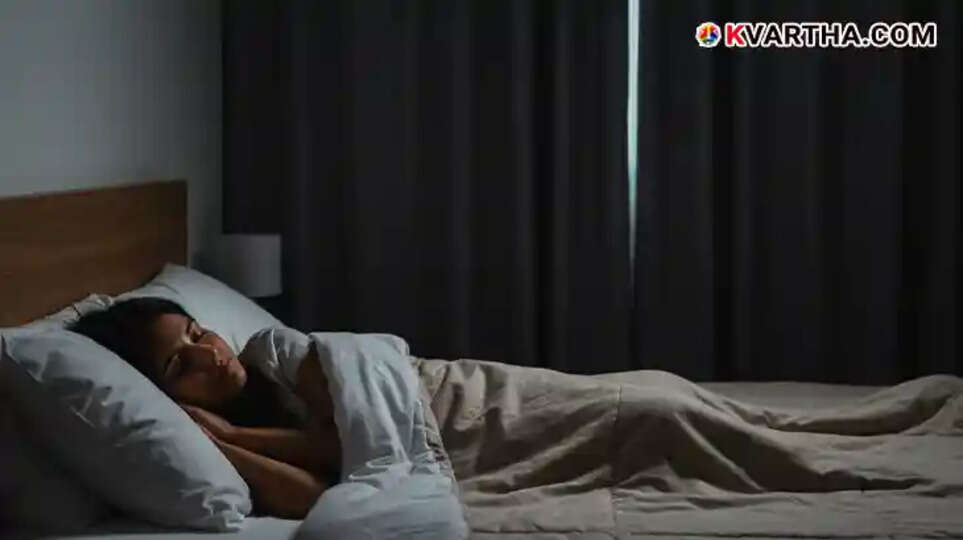 Person sleeping in a dark room