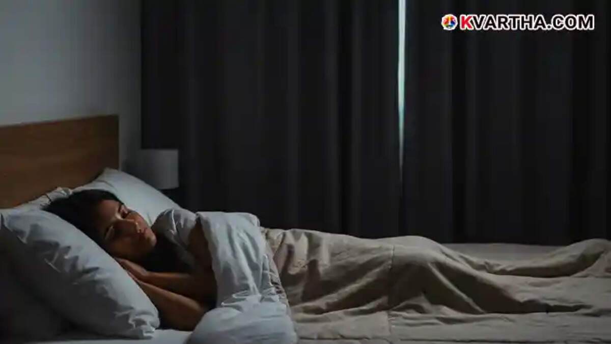 Person sleeping in a dark room