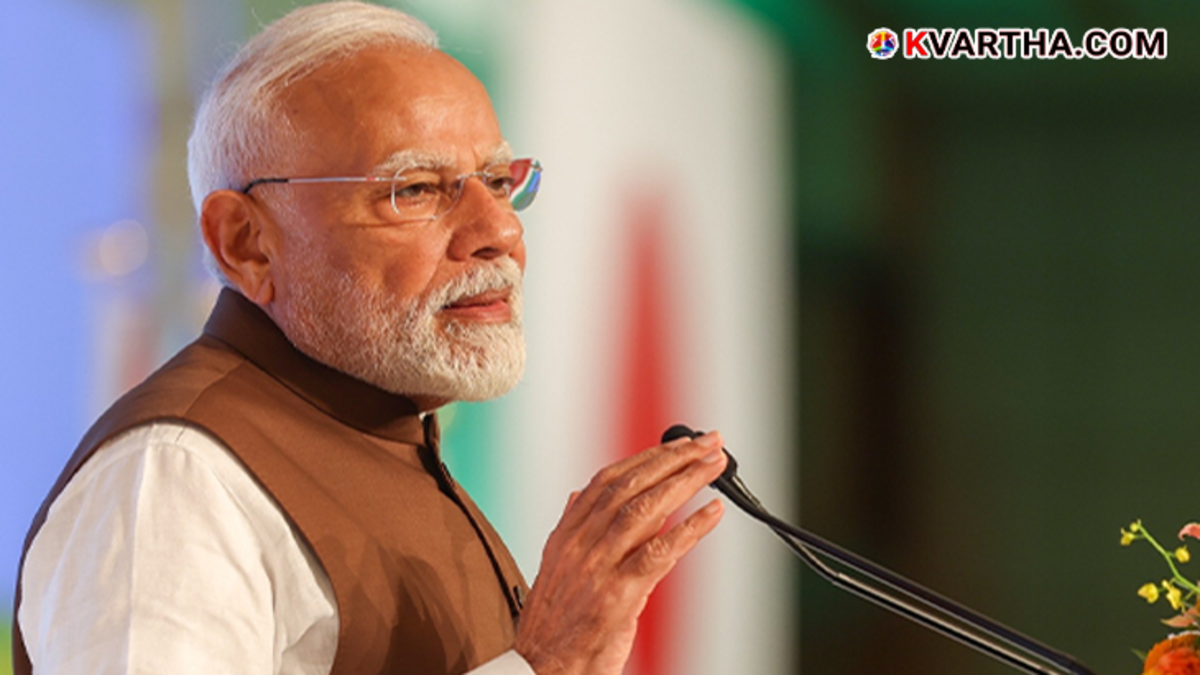Prime Minister Narendra Modi holding the Indian Constitution with respect.