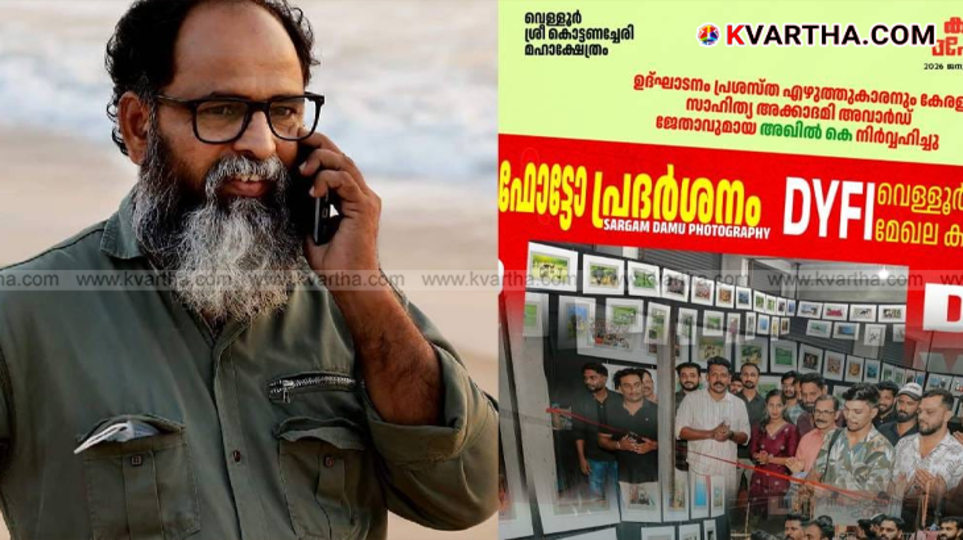 Photographer Damu Sargam holding his camera during an even