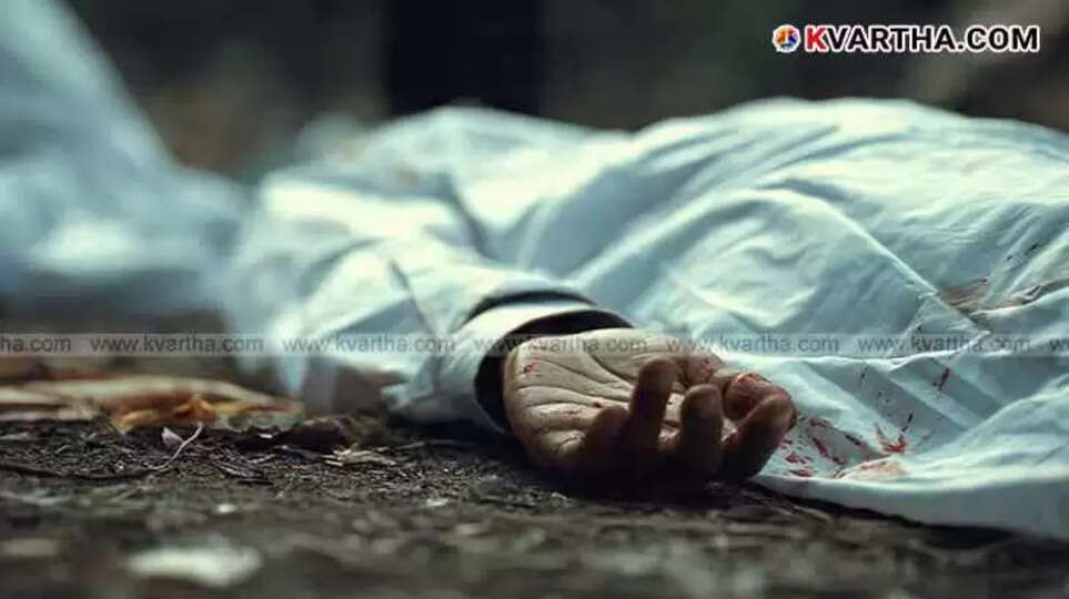 A covered body lies on the ground with a hand visible at a crime scene.
