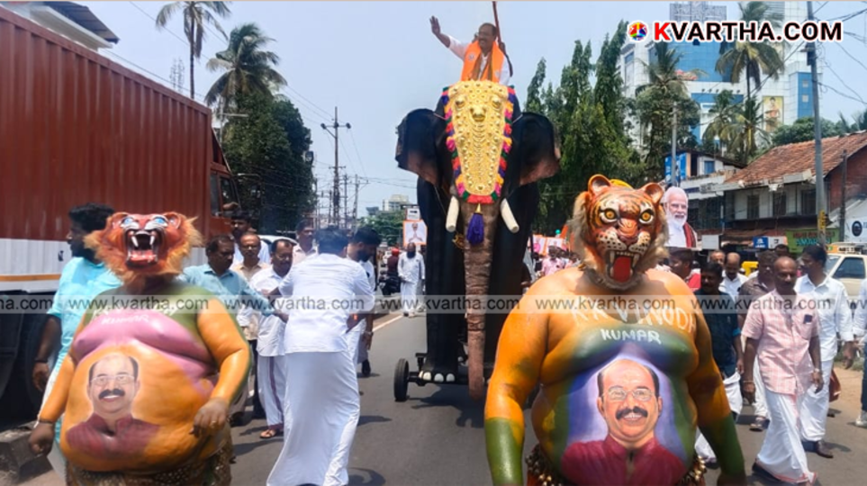 NDA candidate K.K. Vinod Kumar on a robotic elephant during an election rally in Kannur.