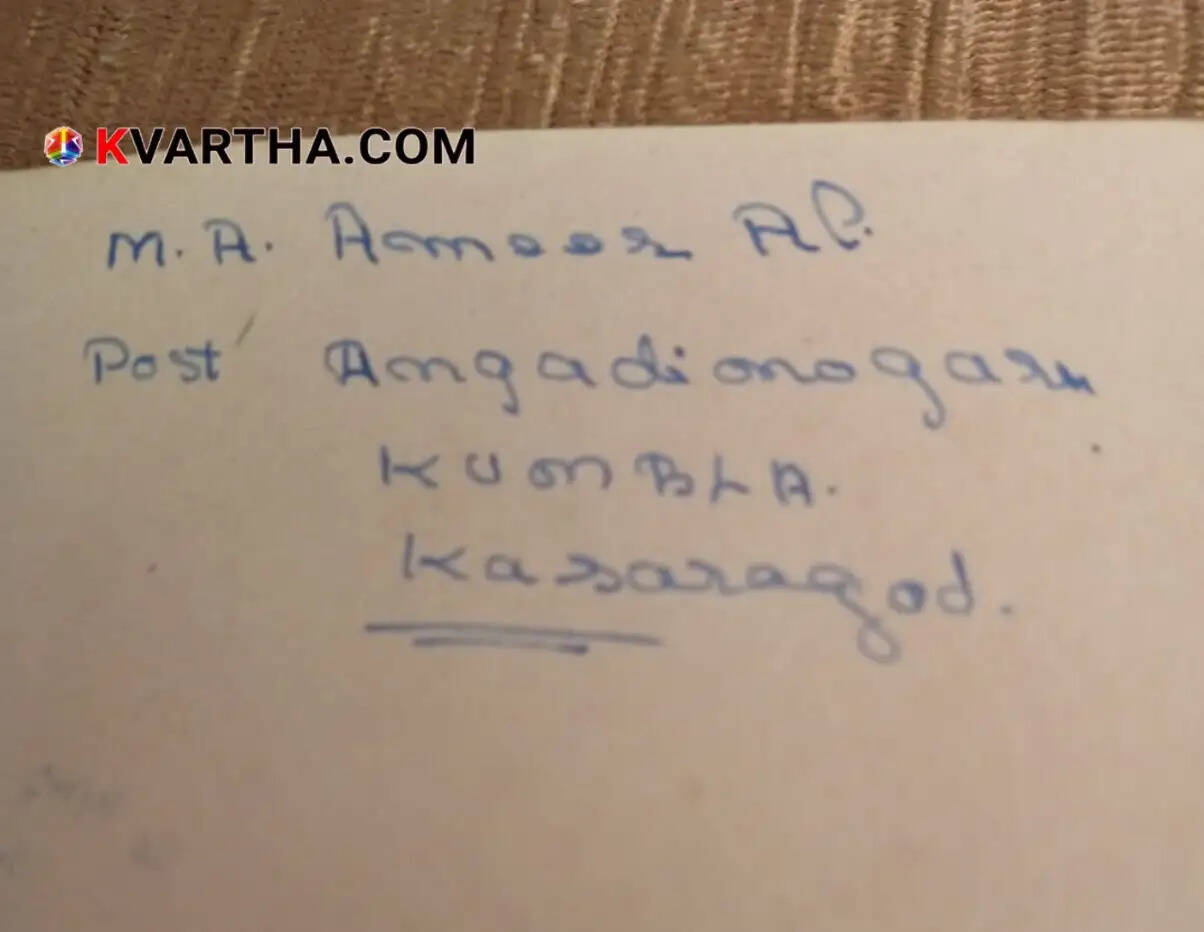 An old, hand-written autograph book with vintage pages.