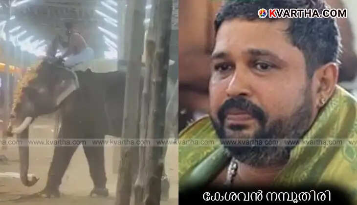  Keshavan Namboothiri holding the idol on the back of a restless elephant.