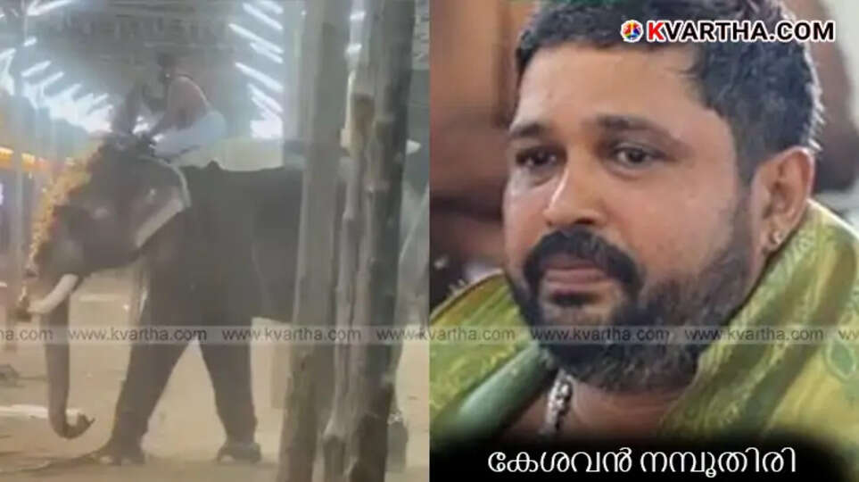 Keshavan Namboothiri holding the idol on the back of a restless elephant.