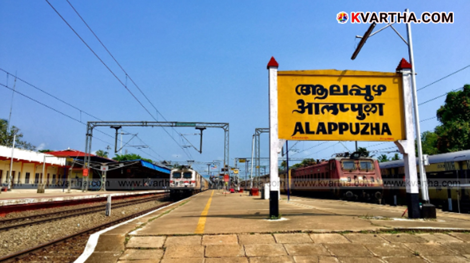 Police officers inspecting a train at a railway station