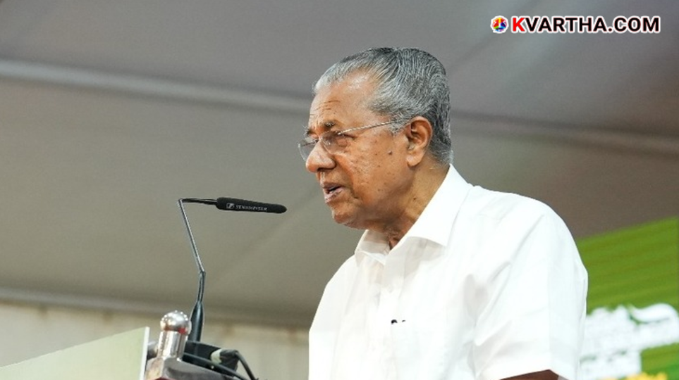 Kerala Chief Minister Pinarayi Vijayan giving a letter.