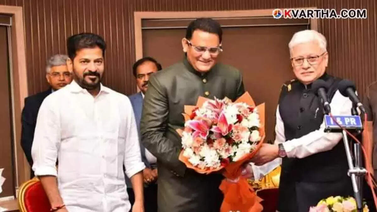 Mohammed Azharuddin taking the oath as a Telangana Minister at Raj Bhavan.