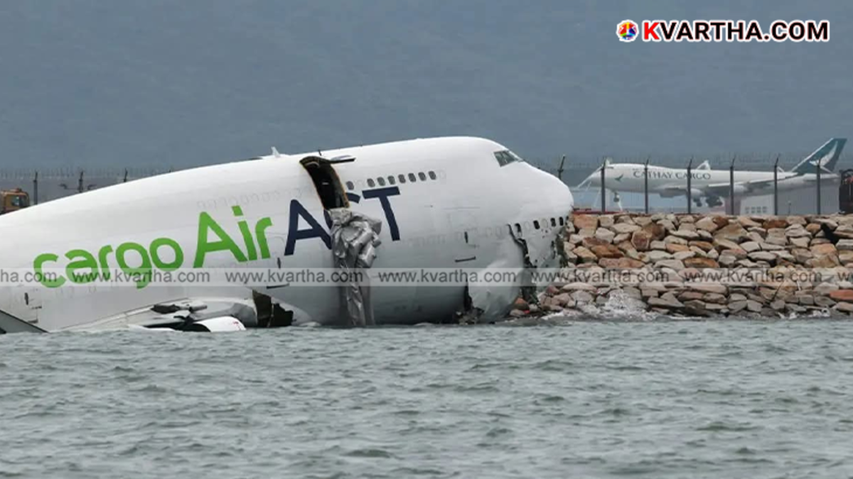 Cargo plane partially submerged in water after skidding off runway in Hong Kong.