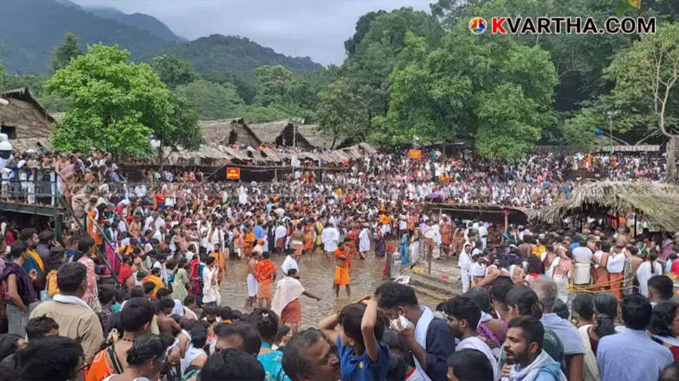 A general view of the Kottiyoor Vaishakha Mahotsavam with devotees gathered around the temple pond.