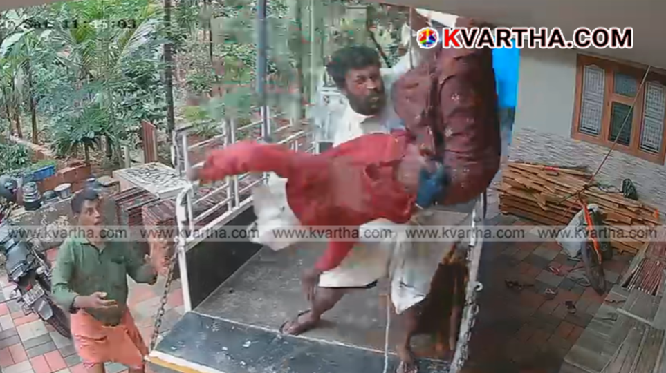 Still from the viral CCTV footage showing the colleague catching the falling construction worker.