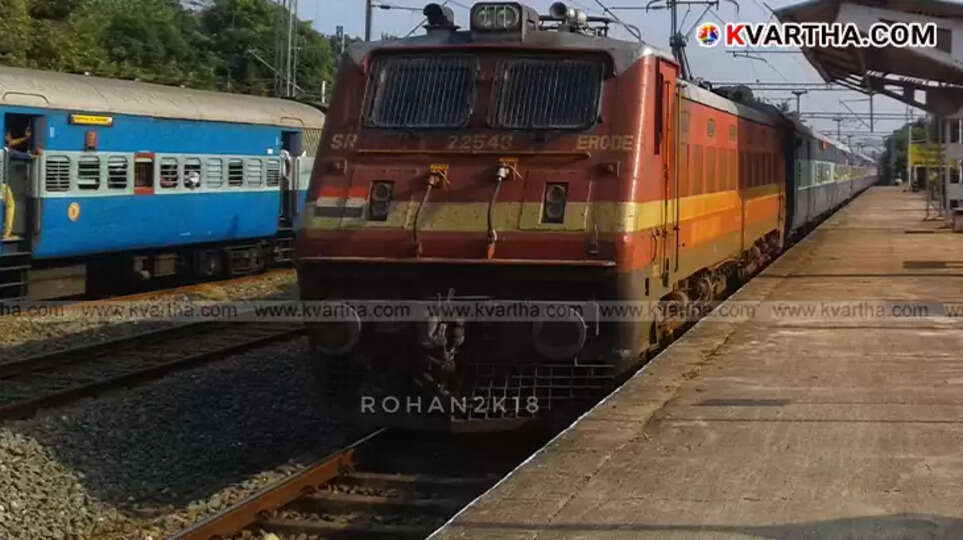 Eranad Express train at a railway station.