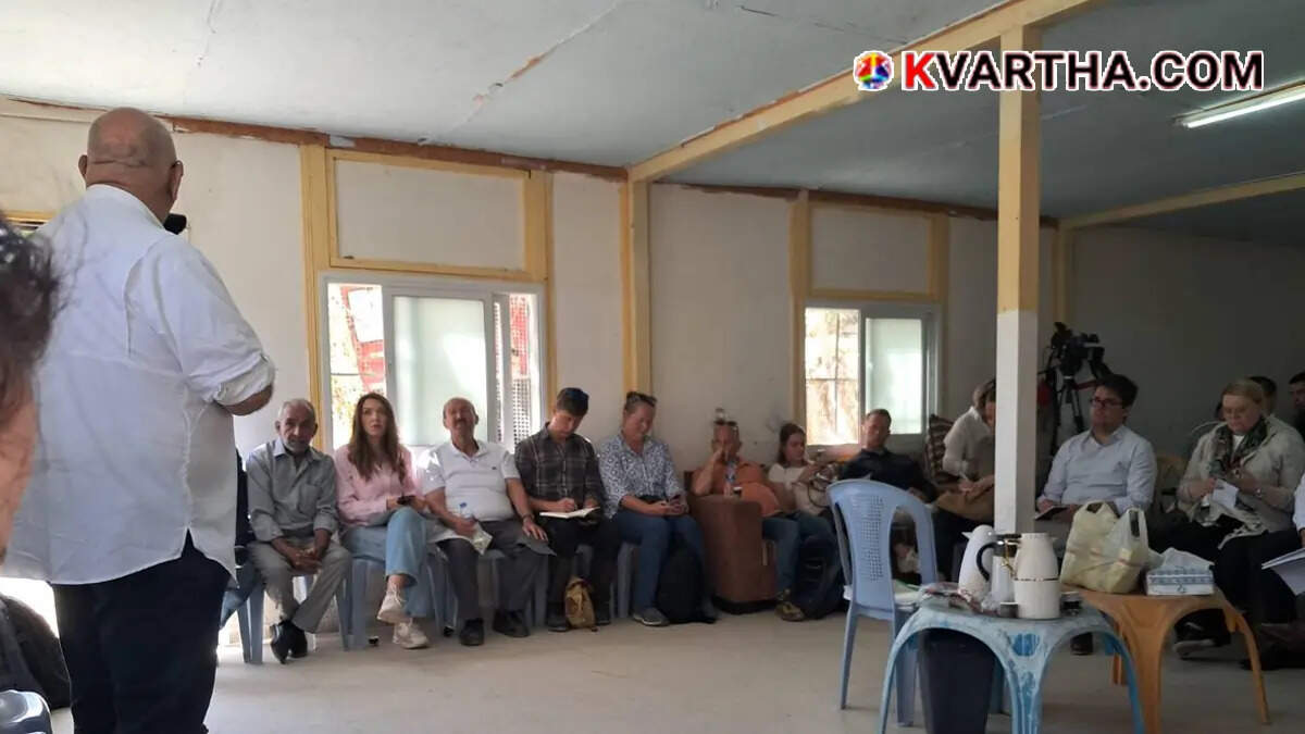 Foreign diplomats talking with Palestinian residents in the village of Khan al-Ahmar