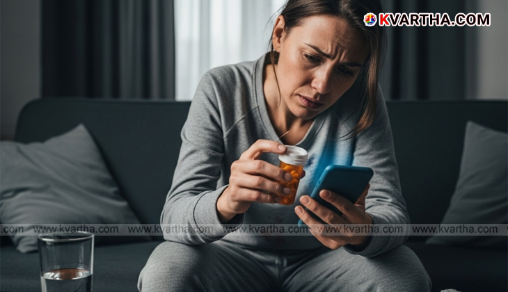 Person holding head with blurred screen background