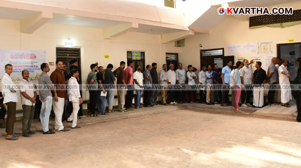 A symbolic scene of the Kerala Assembly elections and voters at the polling booth.