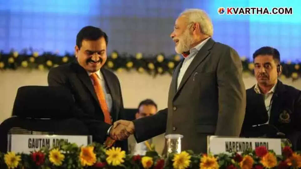 Image of Narendra Modi shaking hands with Gautam Adani