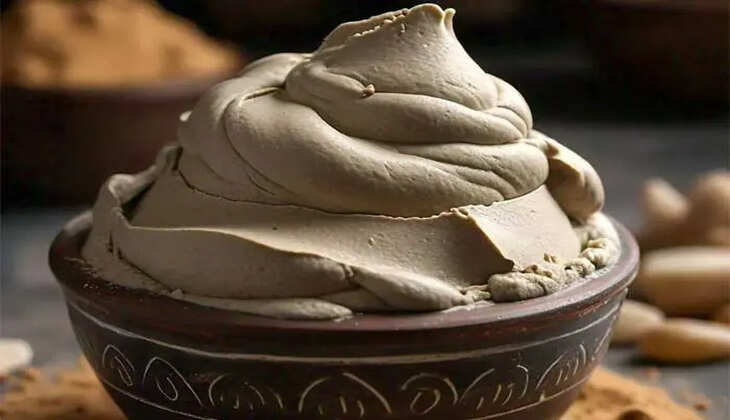 A woman applying a Multani Mitti face mask
