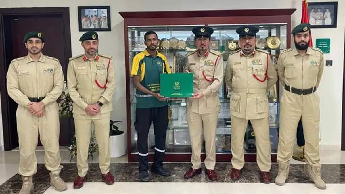 An Indian expat being honored by the Dubai Police for returning lost money.