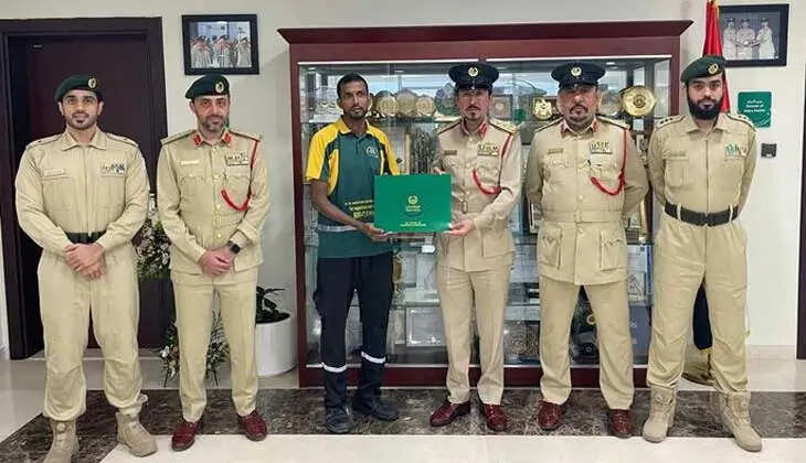 An Indian expat being honored by the Dubai Police for returning lost money.