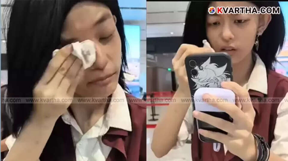 Woman removing makeup at Shanghai airport immigration counter