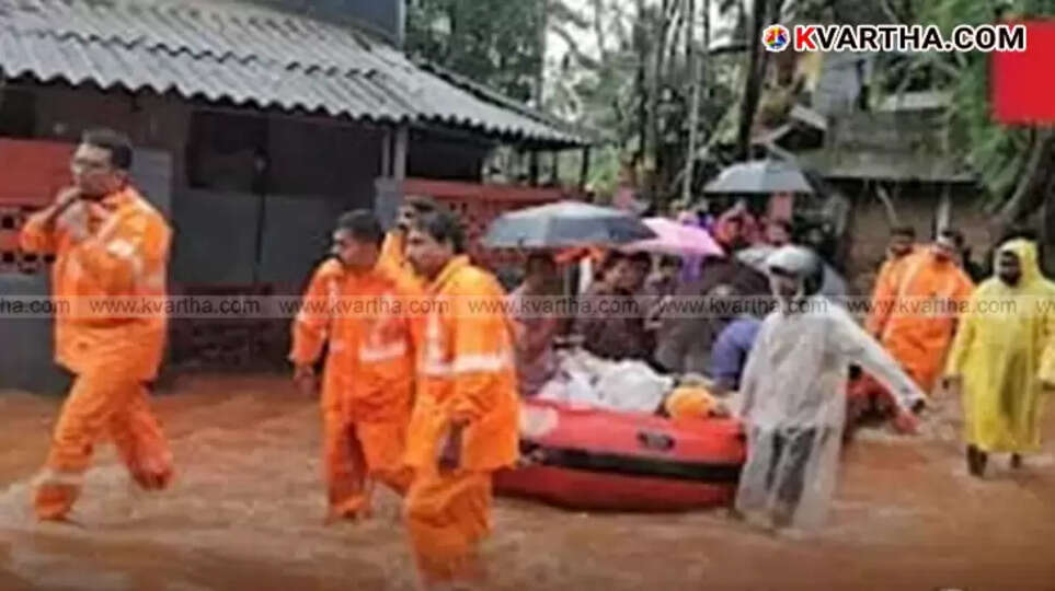 Firefighters rescue people from flooded houses in Tavakkara, Kannur.