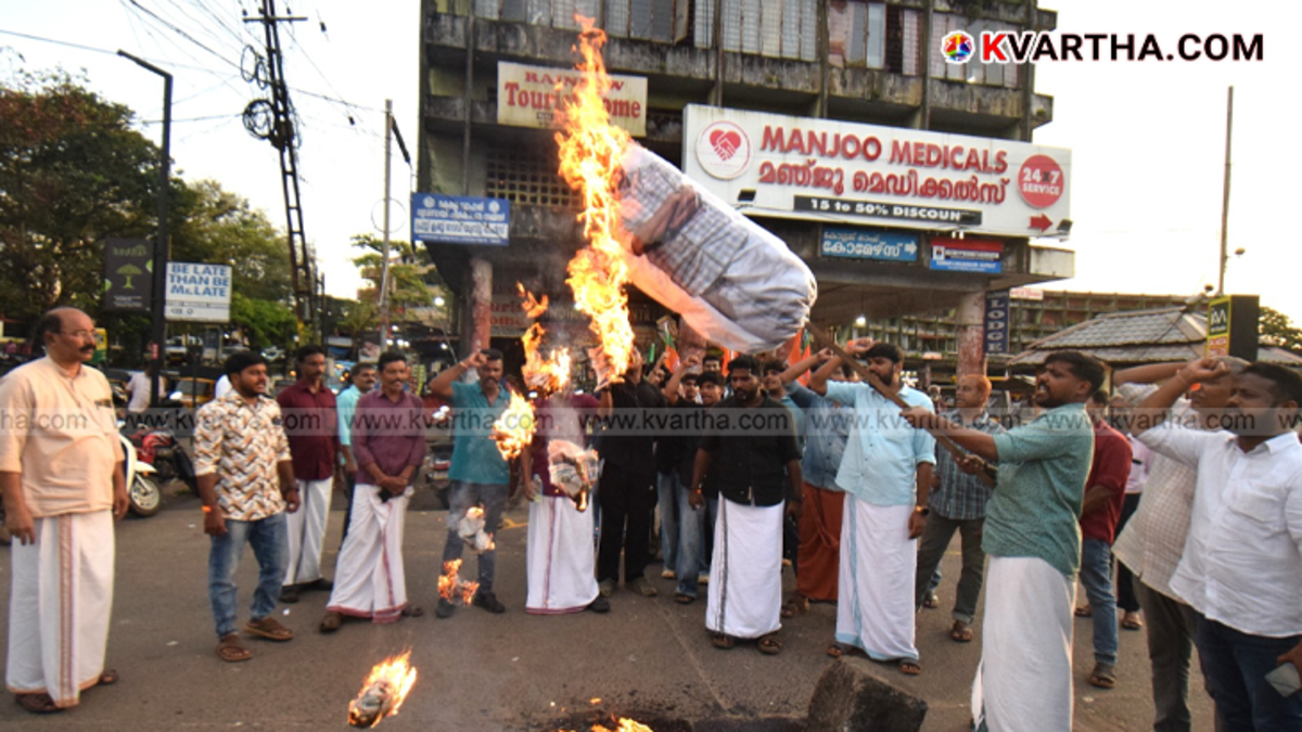 Yuva Morcha workers protesting and burning an effigy of Rahul Mankootathil in Kannur.