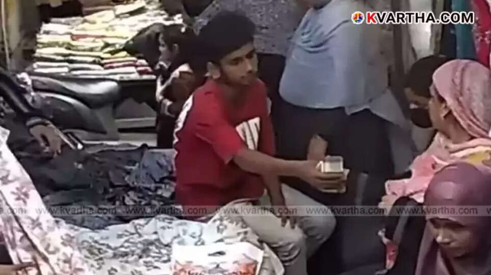 Image showing a hand receiving money, symbolizing the new scam.