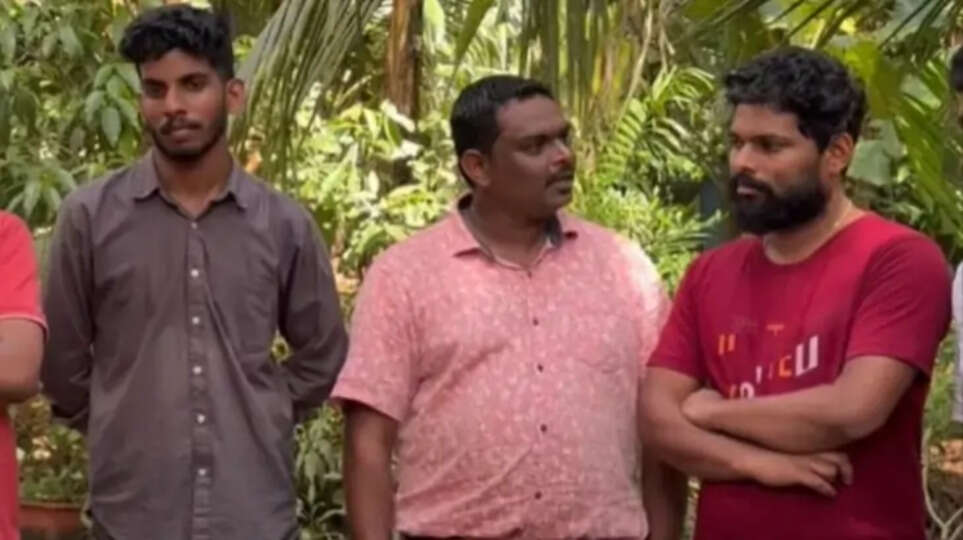 A photo of Arjun's family and Manaf together after resolving their differences.