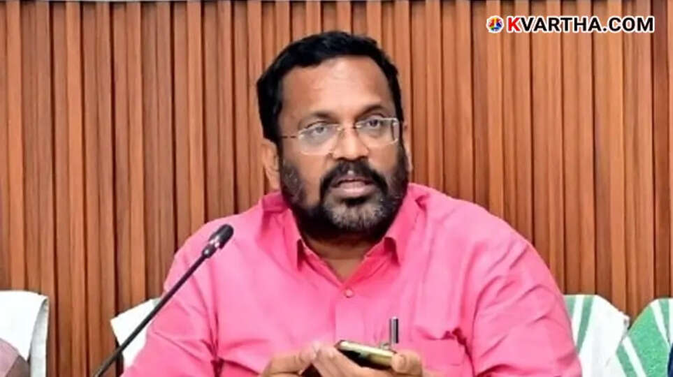 Minister K. Rajan speaking at a press conference.