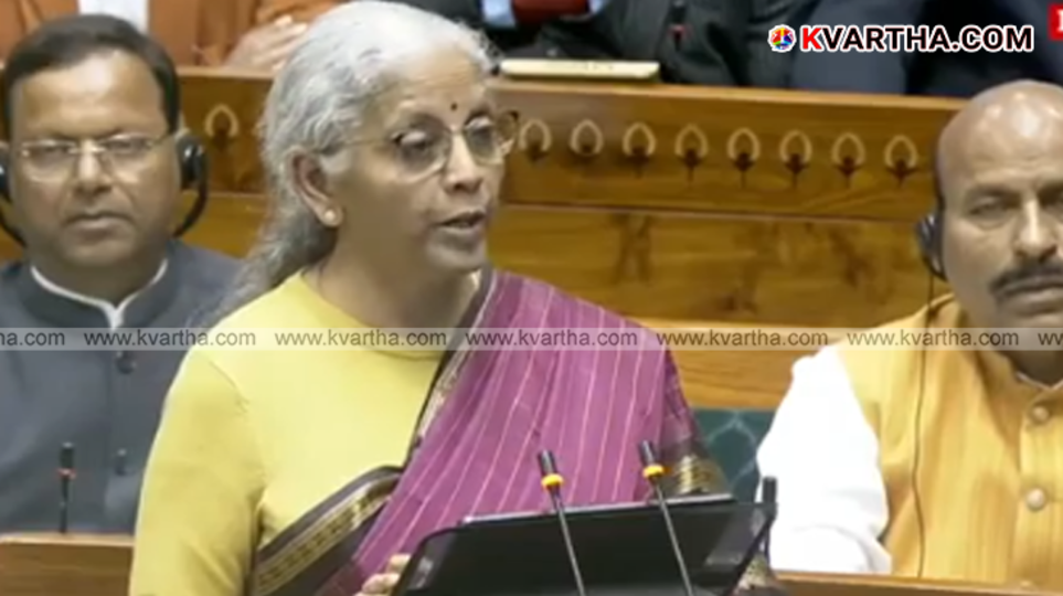 Finance Minister Nirmala Sitharaman holding the digital tablet before presenting the Union Budget 2026.