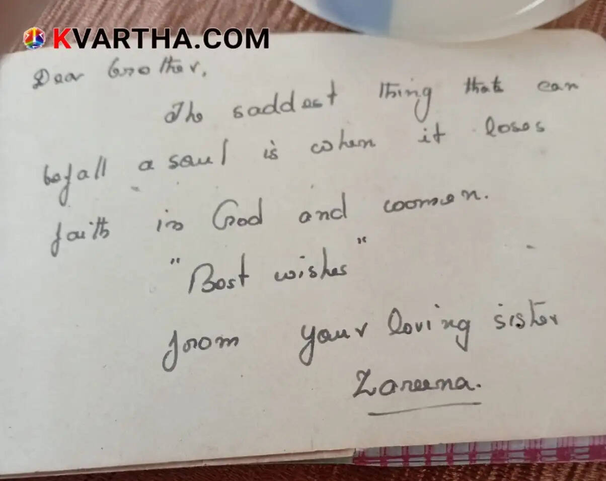 An old, hand-written autograph book with vintage pages.