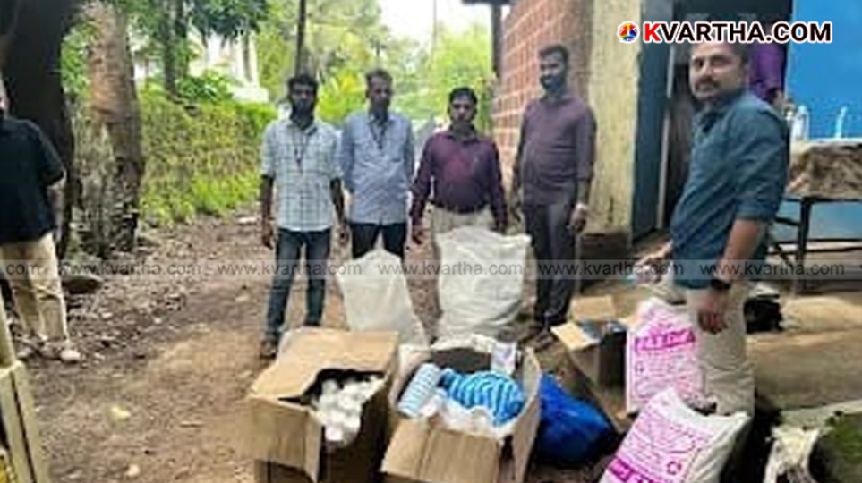 A large pile of plastic waste, including single-use cups and spoons, seized by officials.