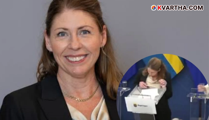 Swedish Minister Elizabeth Land collapsing during a press conference.
