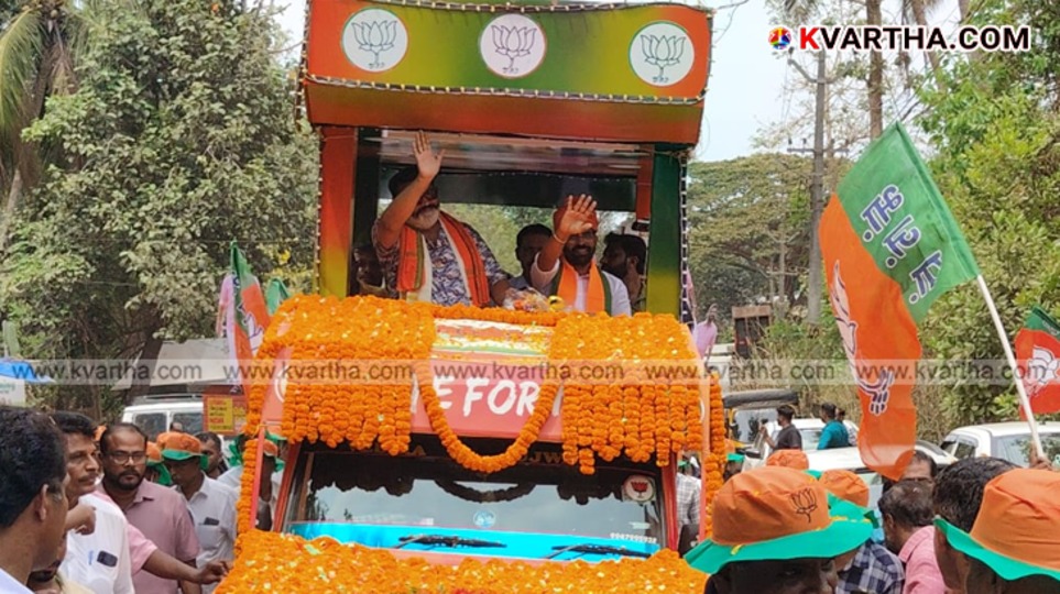 Union Minister Suresh Gopi waving at the crowd during the NDA roadshow in Pinarayi.