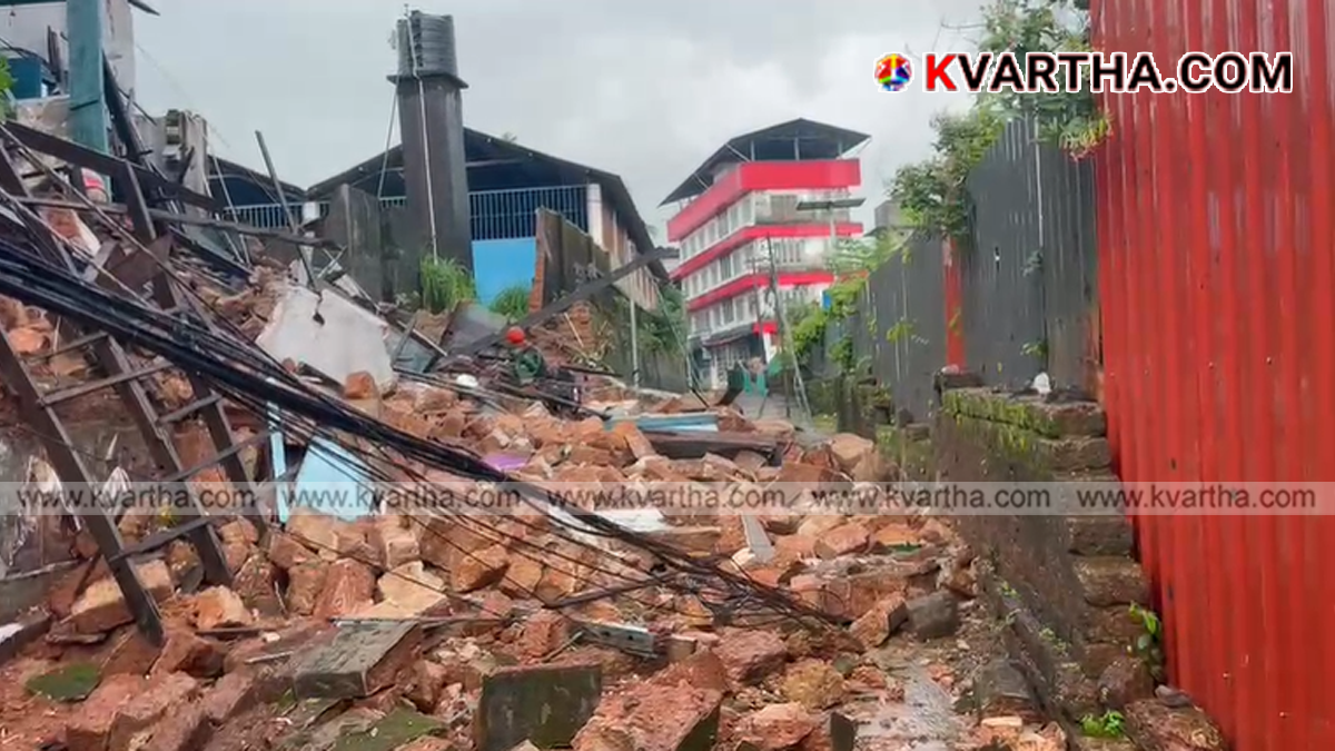 Debris of the collapsed wall and building on the road in Thalap.