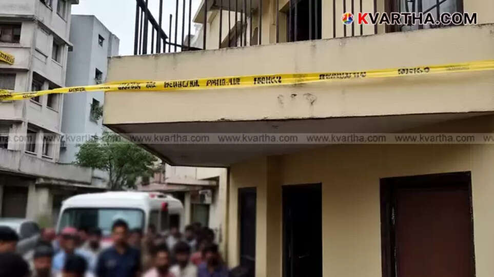 A residential building with a balcony, indicating a crime scene.