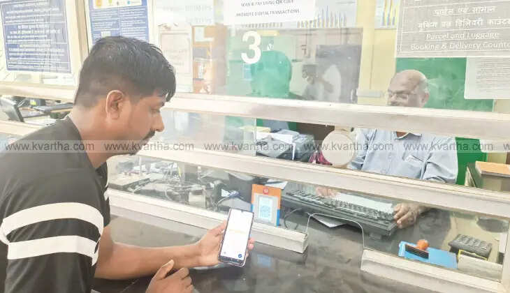 A passenger using QR code payment system at Palakkad Railway Station