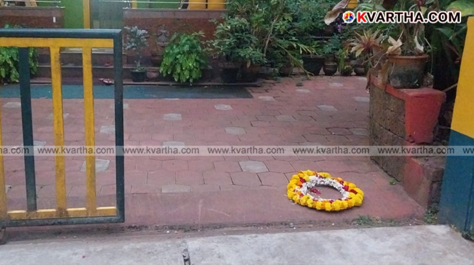 A floral wreath placed at the entrance of writer V.S. Anil Kumar's house.