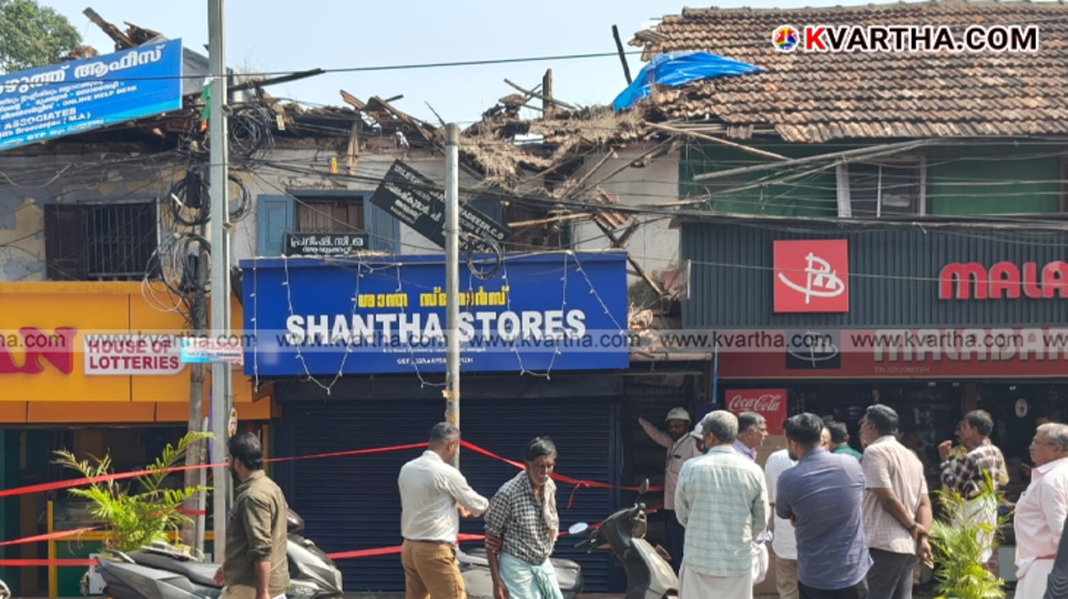 The collapsed roof of an old building on a busy street.