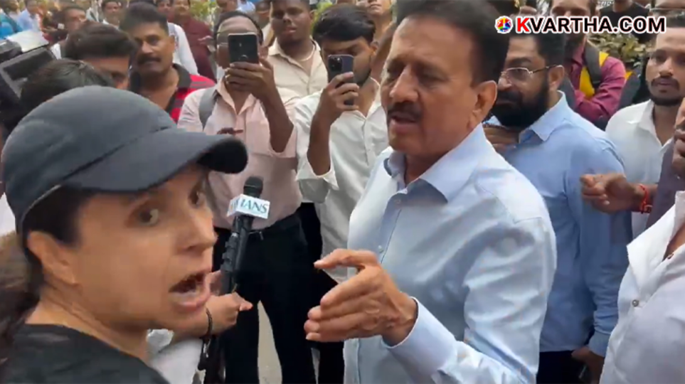 A scene from a video showing a young woman questioning Minister Girish Mahajan over a traffic jam during a BJP rally in Worli, Mumbai.&nbsp;