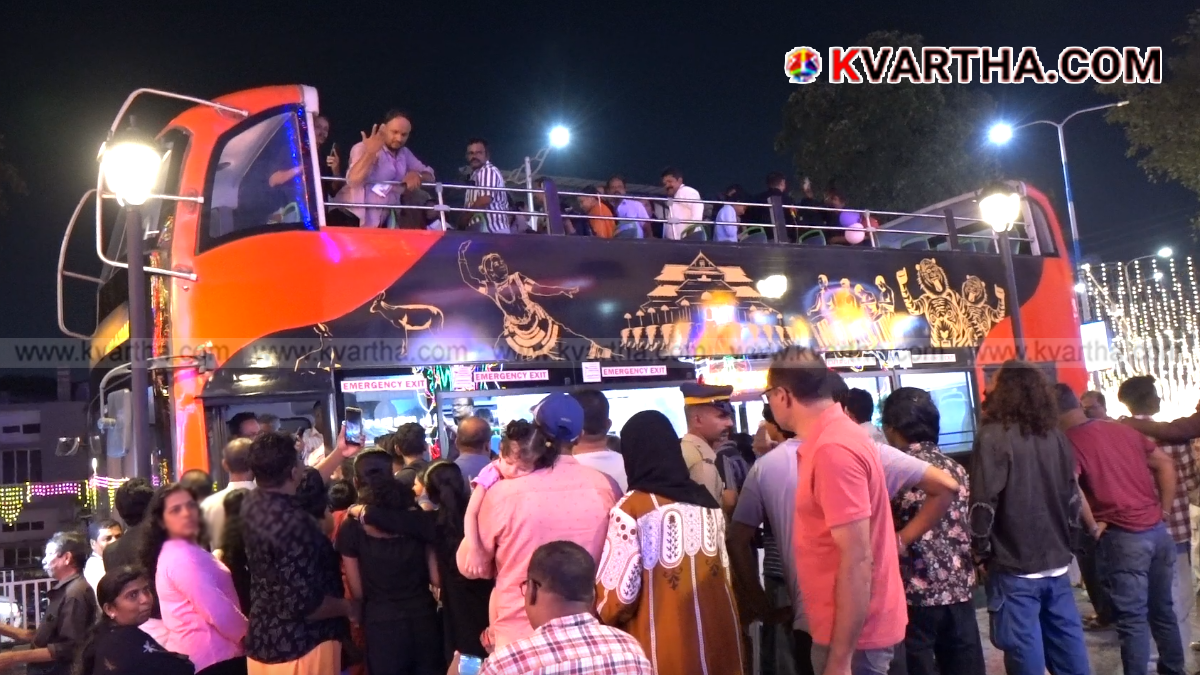 mage reflecting KSRTC double-decker bus tour during Dussehra illuminations in Kannur