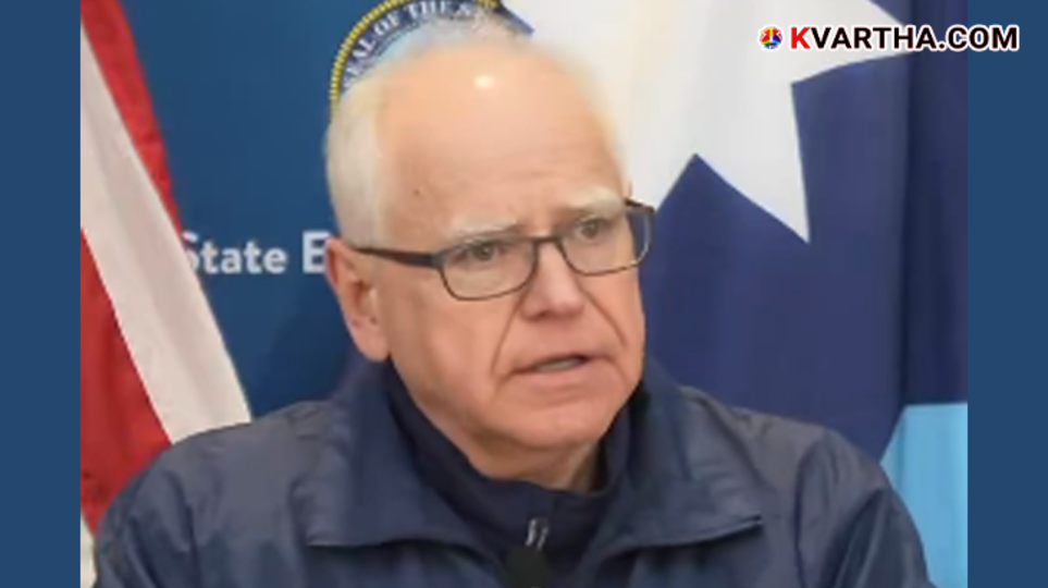 Federal agents in tactical gear standing guard during a protest in Minneapolis.