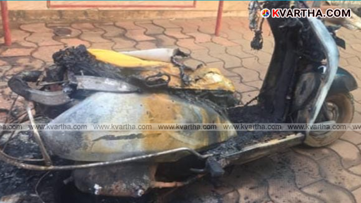 A burnt scooter remains at a market site representing the fire accident in Pilathara, April 2026.