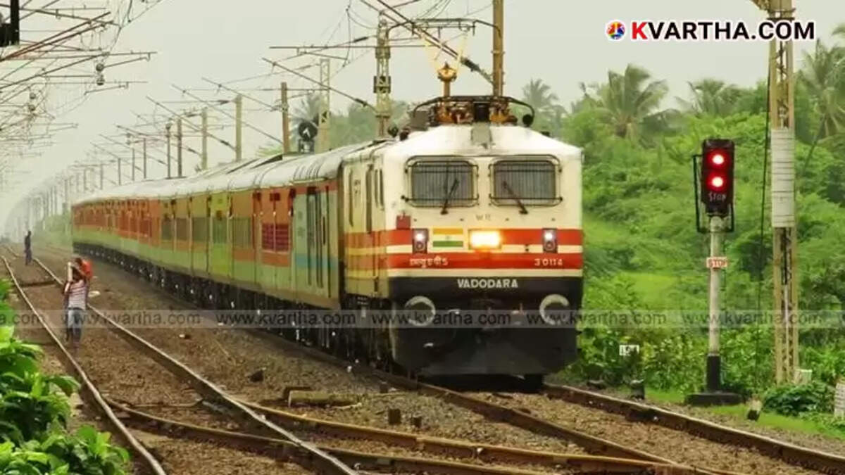 Indian Railways train platform with passengers.
