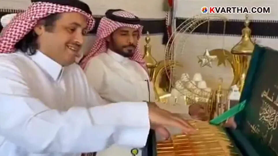 A box filled with gold wrapped chocolates being distributed at a Saudi wedding ceremony.